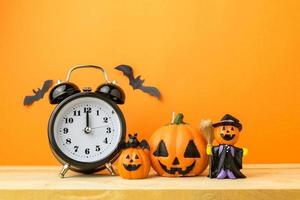 Halloween Pumpkins on wooden table photo