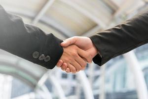 businessmen handshaking. Business partnership concept photo