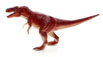 Tyrannosaurus dinosaur toy on white background photo