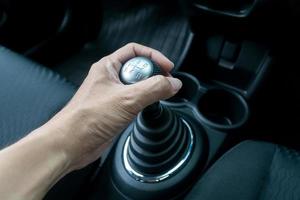 Man hand holding manual transmission photo