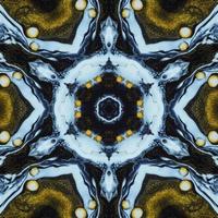 Dark circle abstract background. Kaleidoscope pattern in yellow and blue color. Free Photo