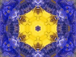 Reflection of colorful flowers in kaleidoscope pattern. Yellow and blue abstract background. Free photo. photo