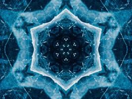 Reflection of deep blue sea in kaleidoscope pattern. Dark blue abstract background. Free photo. photo