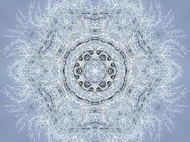 White snow kaleidoscope pattern. Abstract background with winter theme. Free photo. photo