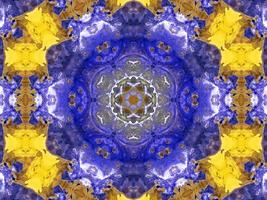 Reflection of colorful flowers in kaleidoscope pattern. Yellow and blue abstract background. Free photo. photo