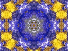 Reflection of colorful flowers in kaleidoscope pattern. Yellow and blue abstract background. Free photo. photo