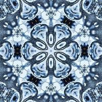 Dark reflection abstract background. Kaleidoscope pattern in black and blue color. Free photo. photo