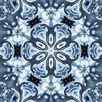 Dark reflection abstract background. Kaleidoscope pattern in black and blue color. Free photo. photo