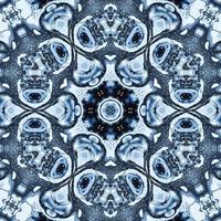 Dark reflection abstract background. Kaleidoscope pattern in black and blue color. Free photo. photo