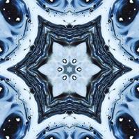 Dark reflection abstract background. Kaleidoscope pattern in black and blue color. Free photo. photo
