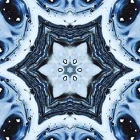 Dark reflection abstract background. Kaleidoscope pattern in black and blue color. Free photo. photo