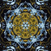 Dark circle abstract background. Kaleidoscope pattern in yellow and blue color. Free Photo