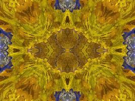 Reflection of colorful flowers in kaleidoscope pattern. Yellow and blue abstract background. Free photo. photo