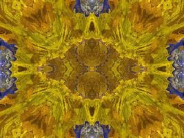 Reflection of colorful flowers in kaleidoscope pattern. Yellow and blue abstract background. Free photo. photo