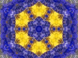 Reflection of colorful flowers in kaleidoscope pattern. Yellow and blue abstract background. Free photo. photo