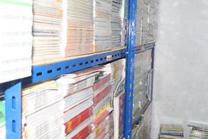 stacks of books on a neat bookshelf suitable for editing material photo