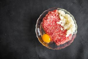 minced meat fresh beef, pork, lamb, chicken healthy meal food snack diet on the table copy space food background rustic top view keto or paleo diet photo