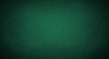 dark green grunge background with soft lightand dark border, old vintage background photo