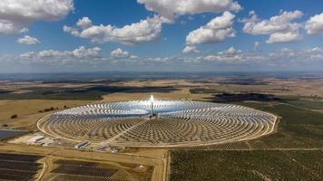 Aerial drone view of Gemasolar Thermosolar Plant in Seville, Spain. Solar energy. Green energy. Alternatives to fossil fuel. Environmentally friendly. Concentrated solar power plant. Renewable energy. photo