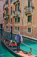 VENICE, ITALY - OCTOBER 17, 2021 gondola on a canal in Venice photo