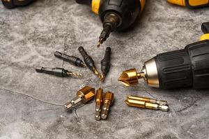 Metric Woodworking Countersink Drill Bit 90 Degree Single Flute Edge Chamfer with Power drill or Cordless screwdriver on desk in workshop.selective focus photo