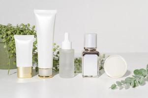 moisturizing cream bottle over leaf background studio, packing and skincare beauty concept photo