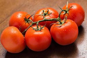 Fresh and wet tomatoes photo