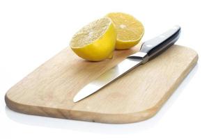 Lemon over chopping board photo