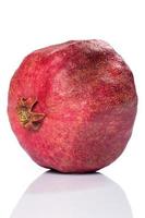 Whole pomegranate isolated on white photo