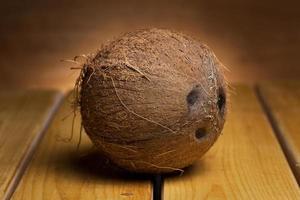 Coconut over wooden background photo