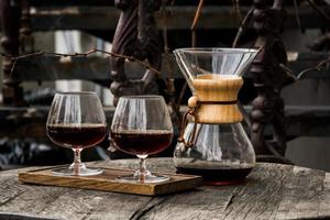 iltered coffee prepearing, brewing of coffee in paper filter close up photo