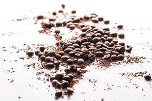 Coffee beans and particles of black chocolate photo