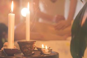 close up of massage process. Woman hands do massage in spa. photo