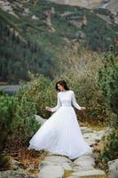 Bride near the Sea-eye lake in Poland photo