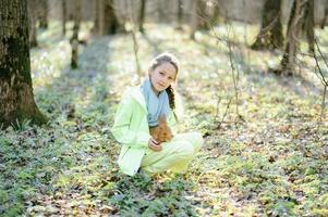 Little girl with a rabbit photo