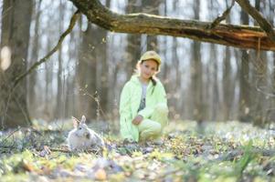Little girl with a rabbit photo
