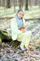 Little girl with a rabbit photo