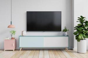 TV on the cabinet in modern living room on white wall background. photo