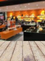 Empty table and blurred store with bokeh background, product display template. photo