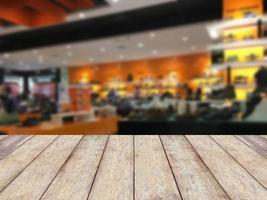 Empty table and blurred store with bokeh background, product display template. photo