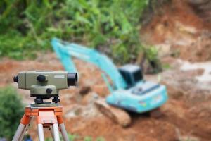 Surveyor equipment theodolite at construction site photo