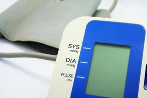 Digital Blood Pressure Monitor on white background photo