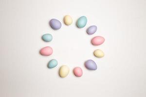 Pastel colored Easter eggs on a white background photo