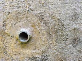 Cement walls with pipe holes photo