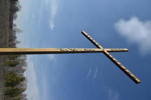 Wooden Orthodox cross against the sky photo