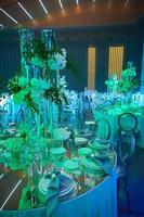 Table setup in blue light. Ready to event. photo