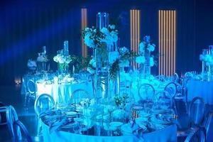 Table setup in blue light. Ready to event. photo