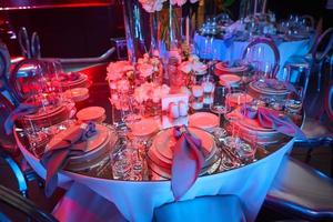Table setup in red light. Ready to event. Shallow dof photo