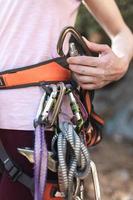 Carabiners and quickdraws on the climber's harness photo