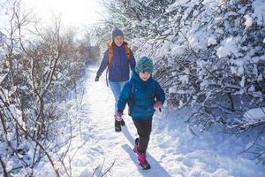 The child runs away from mom. photo